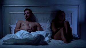 counhappy couple in bed in the dark looking uncomfortable about intimacy issues before going to sex therapy in Bradenton, FL at forever free counseling