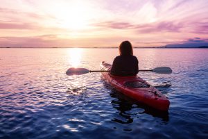 Grief counseling | grief therapy | online therapy in Florida | Forever Free Counseling woman kayaking at sunset in Florida. She also got grief counseling in Bradenton, FL and online therapy in Florida at Forever Free Counseling 34203